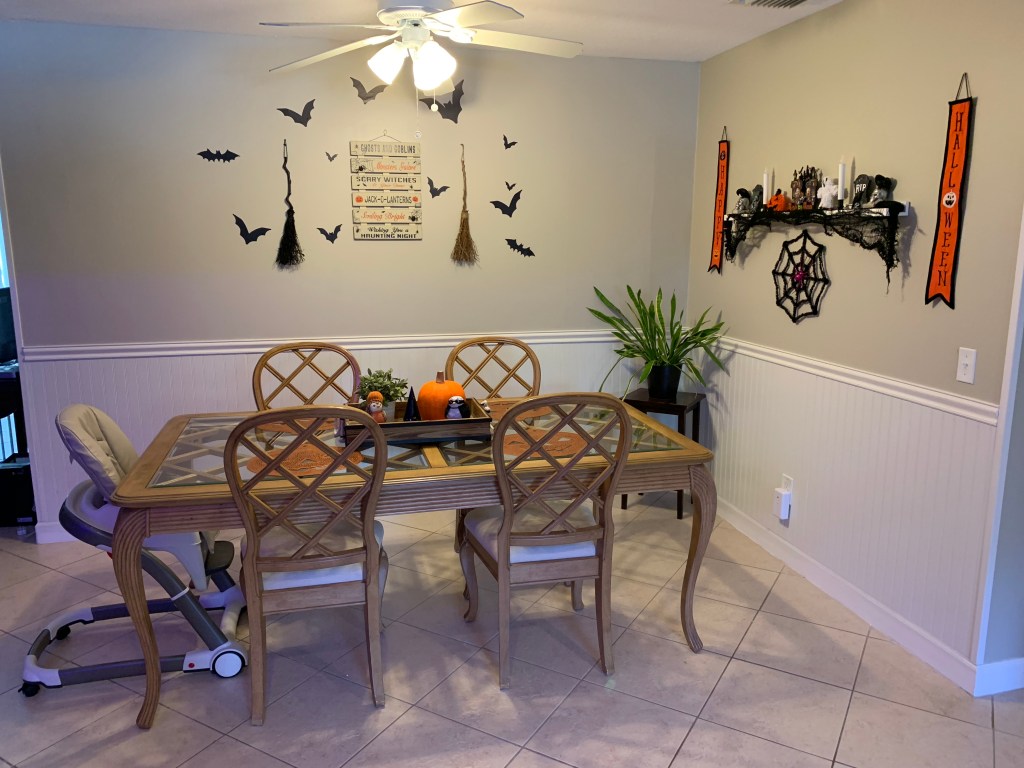 Dining area before Toy Story birthday transformation, decorated for Halloween