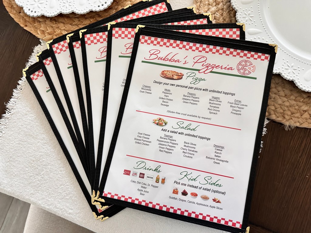 DIY Bubba’s Pizzeria menus printed at home and placed inside real menu sleeves.