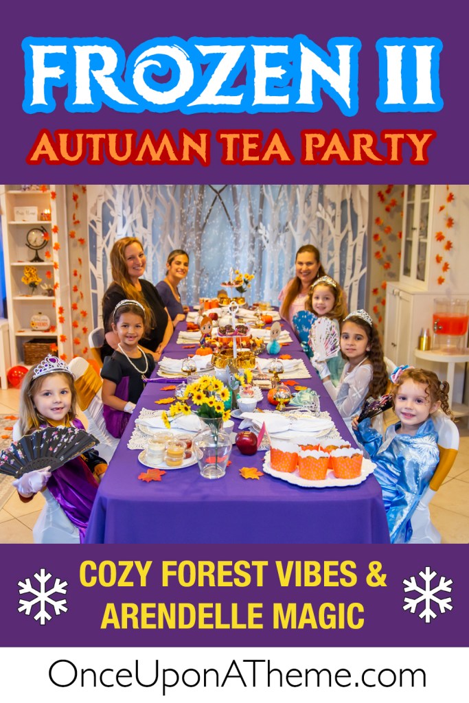 A group of young girls dressed as Frozen characters sit at a fall-themed tea party table with purple linens, autumn leaves, sunflowers, and themed desserts. The scene includes a magical forest backdrop, cozy decorations, and joyful party guests celebrating a Frozen II autumn birthday.