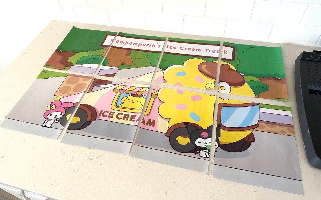 All printed pages arranged together like puzzle pieces to form a complete Pompompurin ice cream truck design for a large party sign.