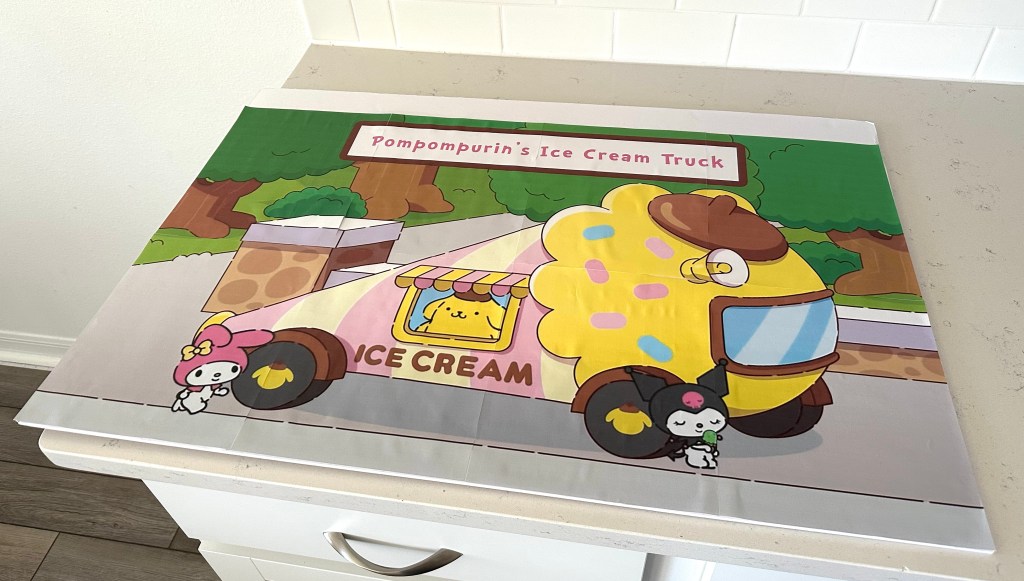 The completed large Sanrio ice cream truck image mounted securely onto a piece of foam board.