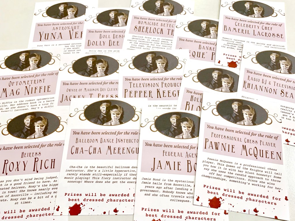 A spread of printed character cards featuring roles like astronaut, optometrist, dance instructor, and TV producer, each with themed graphics and blood-spattered text.